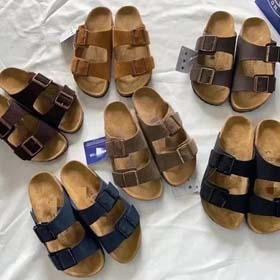 BIRKENSTOCK Hombres perezosos y mujeres doble hebilla zapatillas planas de cuero genuino corcho foot
